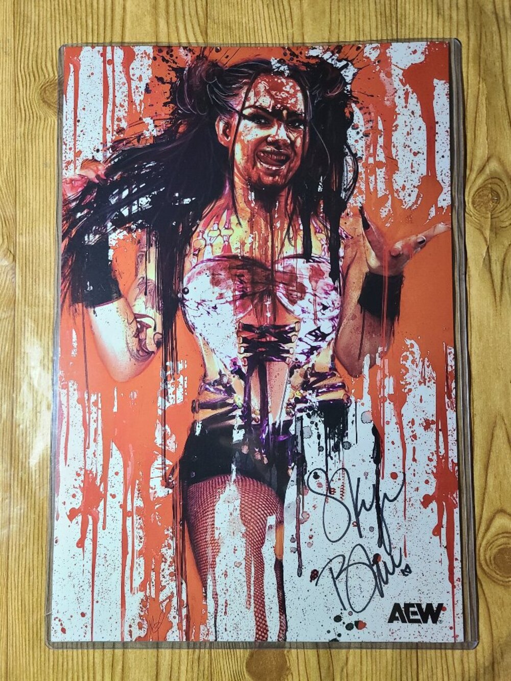 Skye Blue AEW official autographed 12"X18" print in top loader plastic